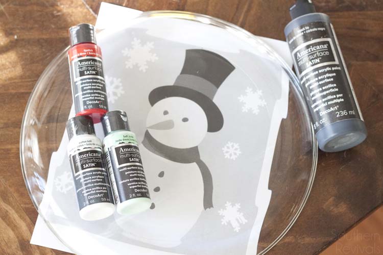 Super easy and oh so cute! If you have at least one hand and some paint brushes you can DIY your own Snowman Christmas Cookie Platter, too. Here's how!