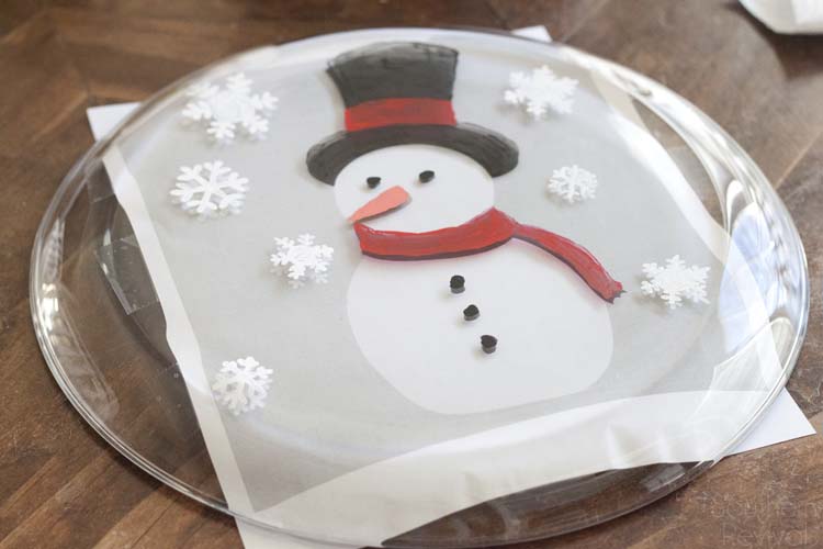 Super easy and oh so cute! If you have at least one hand and some paint brushes you can DIY your own Snowman Christmas Cookie Platter, too. Here's how!