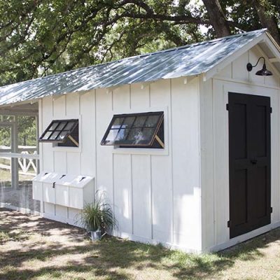 white and black farmhouse chicken coop