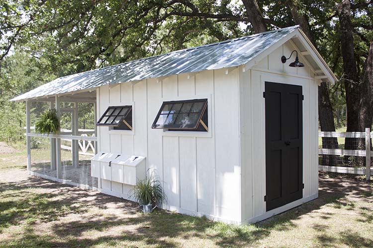 white and black farmhouse chicken coop