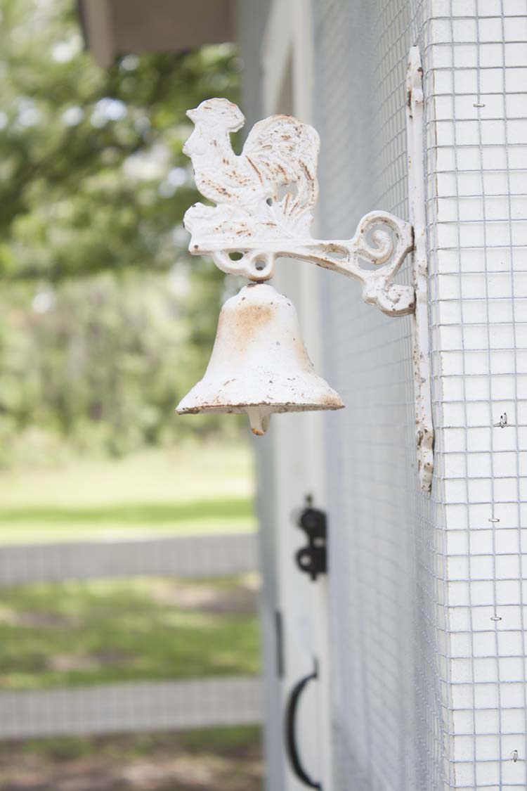 white cast iron chicken bell