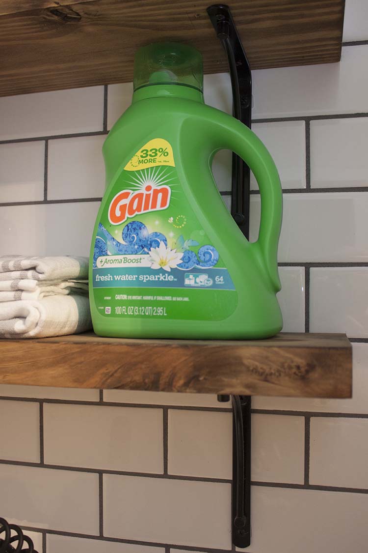 laundry detergent on wood shelf