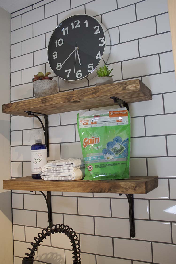 subway tile wall wood shelves