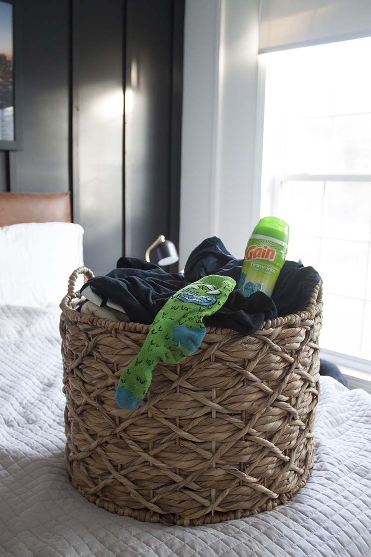 laundry basket on bed 