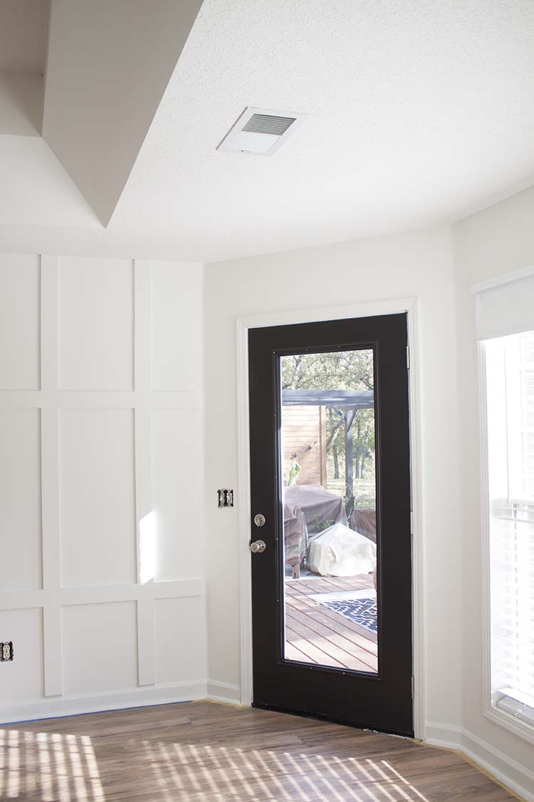 white board and batten black door