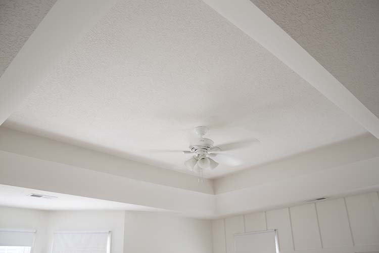 White trayed ceiling white bedroom