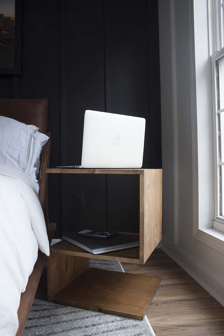 modern wood side table black wall